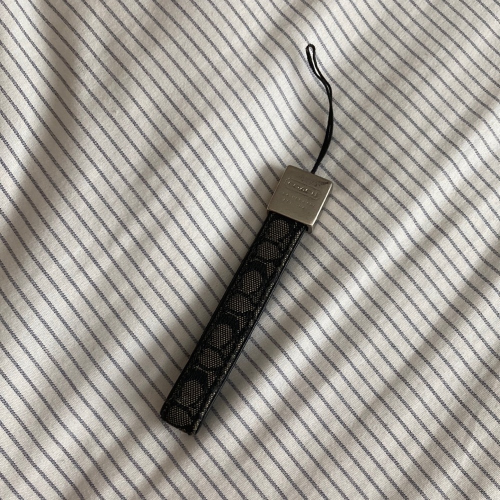 Used coach phone charm